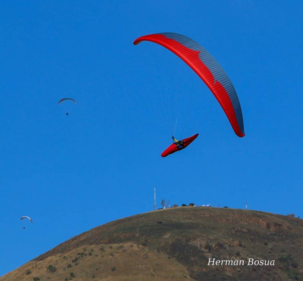 The Competition DNA Behind Every Tandem Flight at Cape Hope Paragliding.